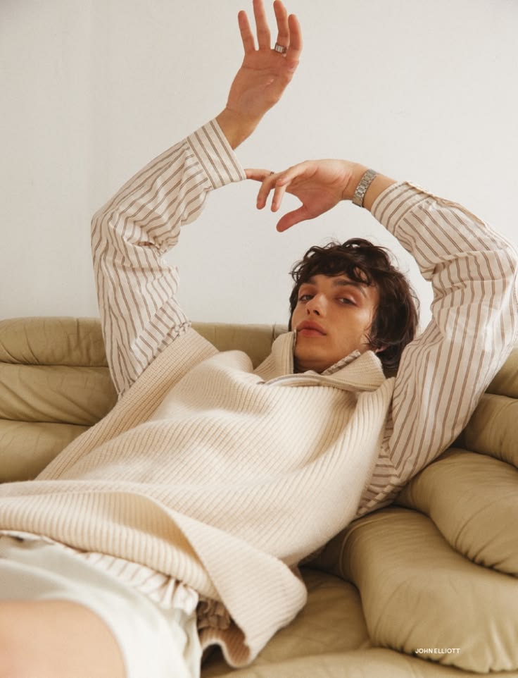 Fashion editorial portrait on a cream sofa